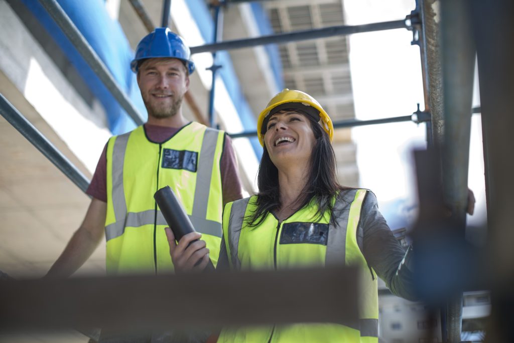 Two engineers inspecting construction site